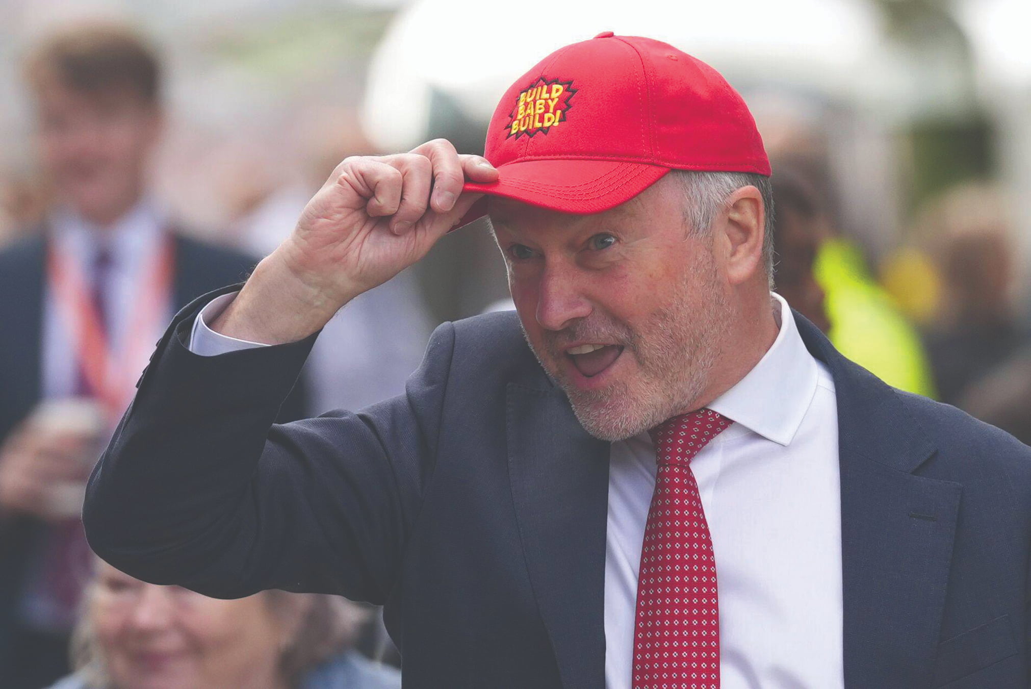 Housing secretary Steve Reed shows off a MAGA-inspired Build Baby Build cap
