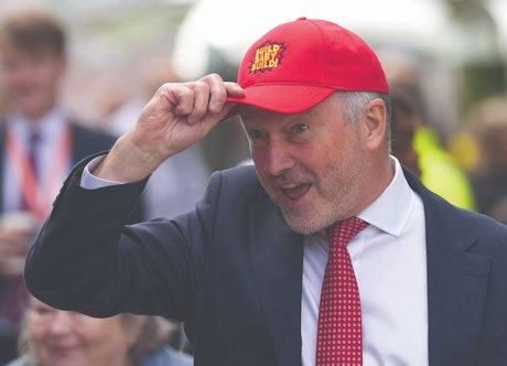 Housing secretary Steve Reed shows off a MAGA-inspired Build Baby Build cap