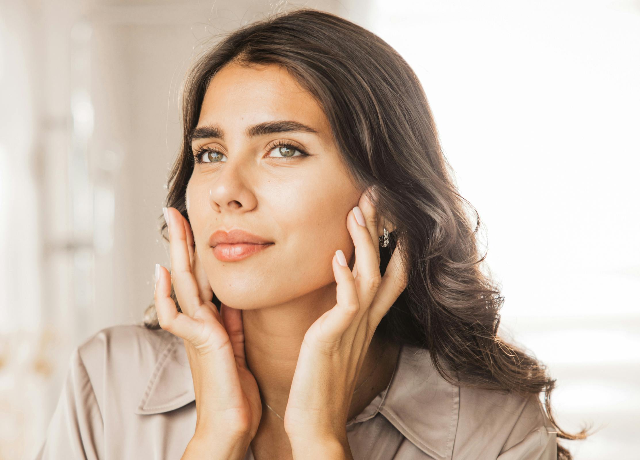 Woman touching her face