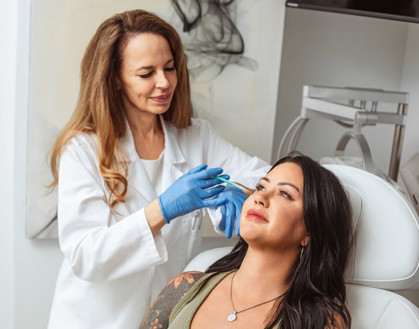 Dr.Restivo doing a procedure on a patient