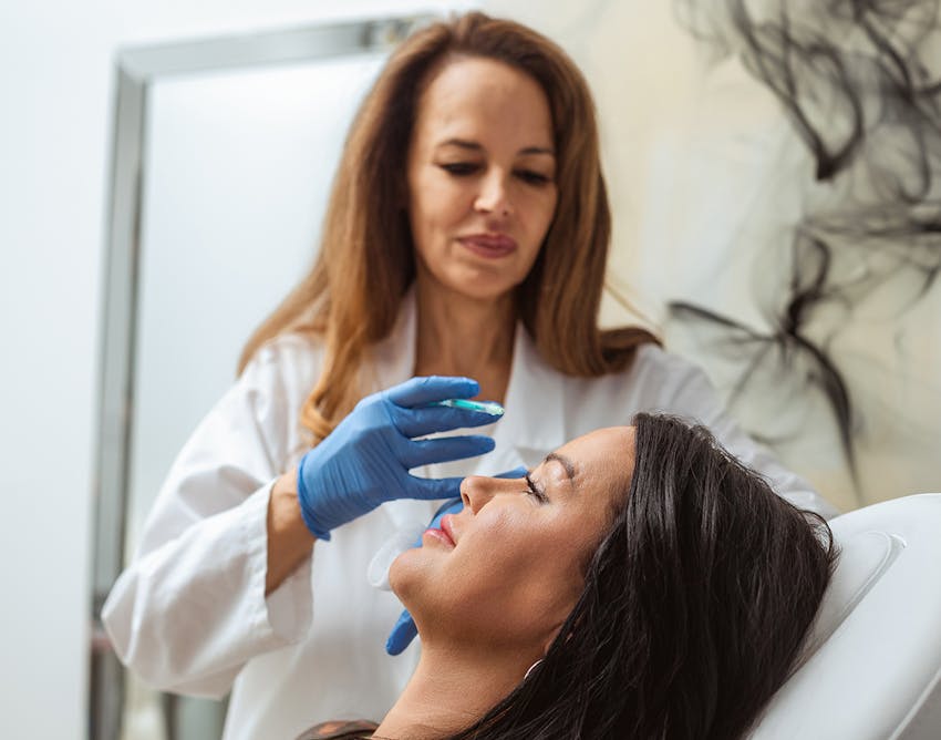 Dr.Restivo doing a procedure on a patient