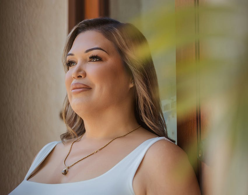 Woman smiling looking straight ahead