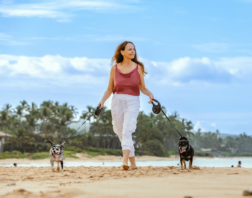 Dr.Restivo walking dogs on the beach