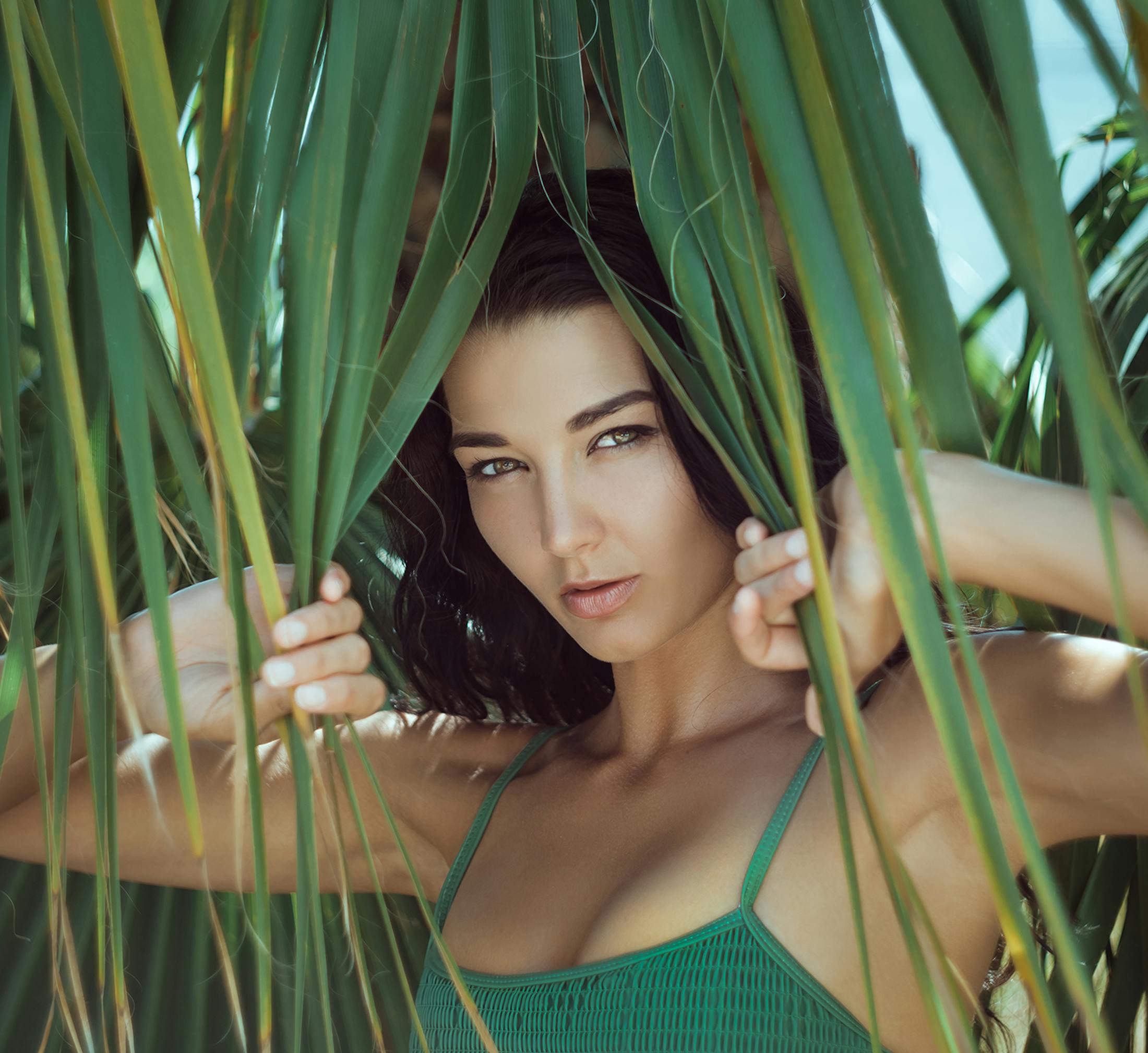 Woman touching leaves