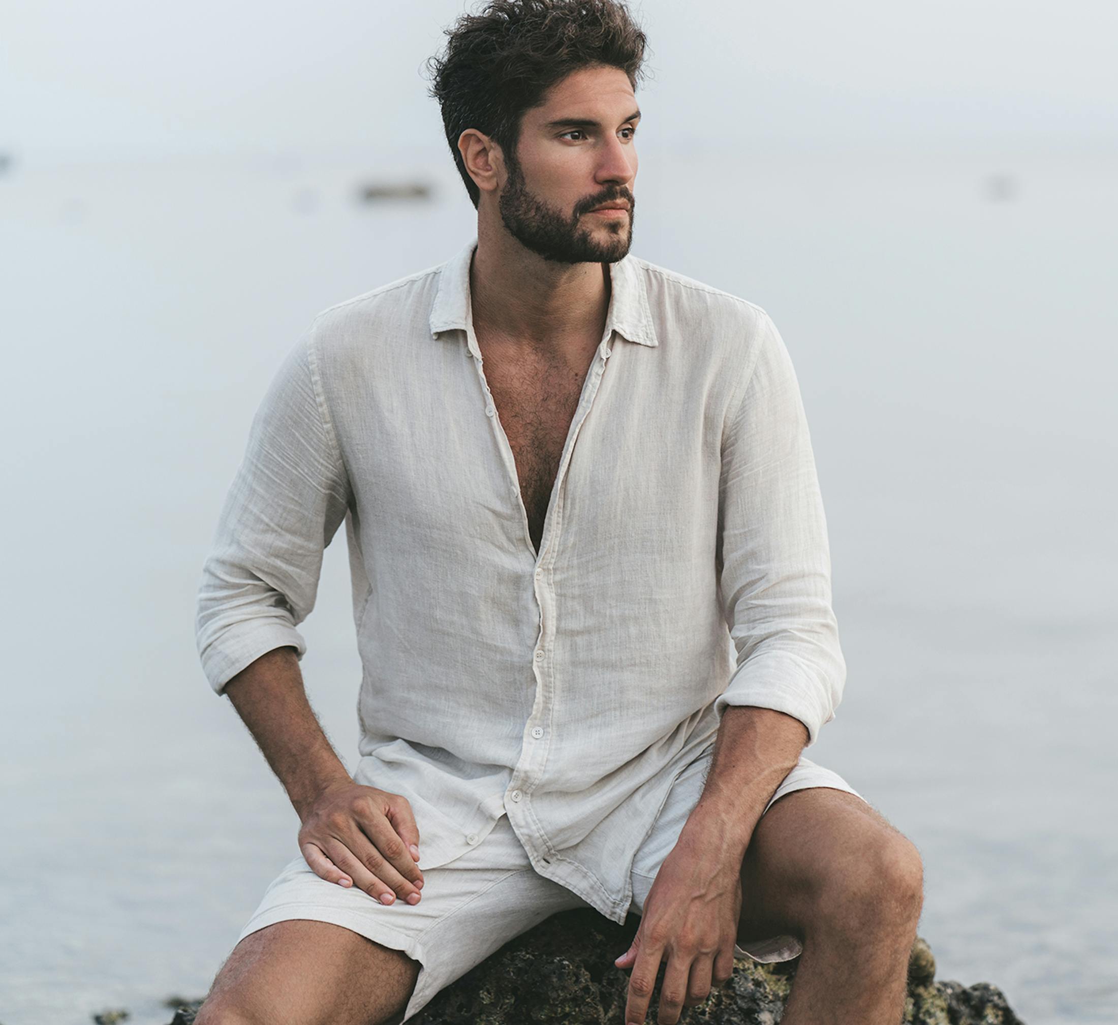 man sitting and looking off to the side