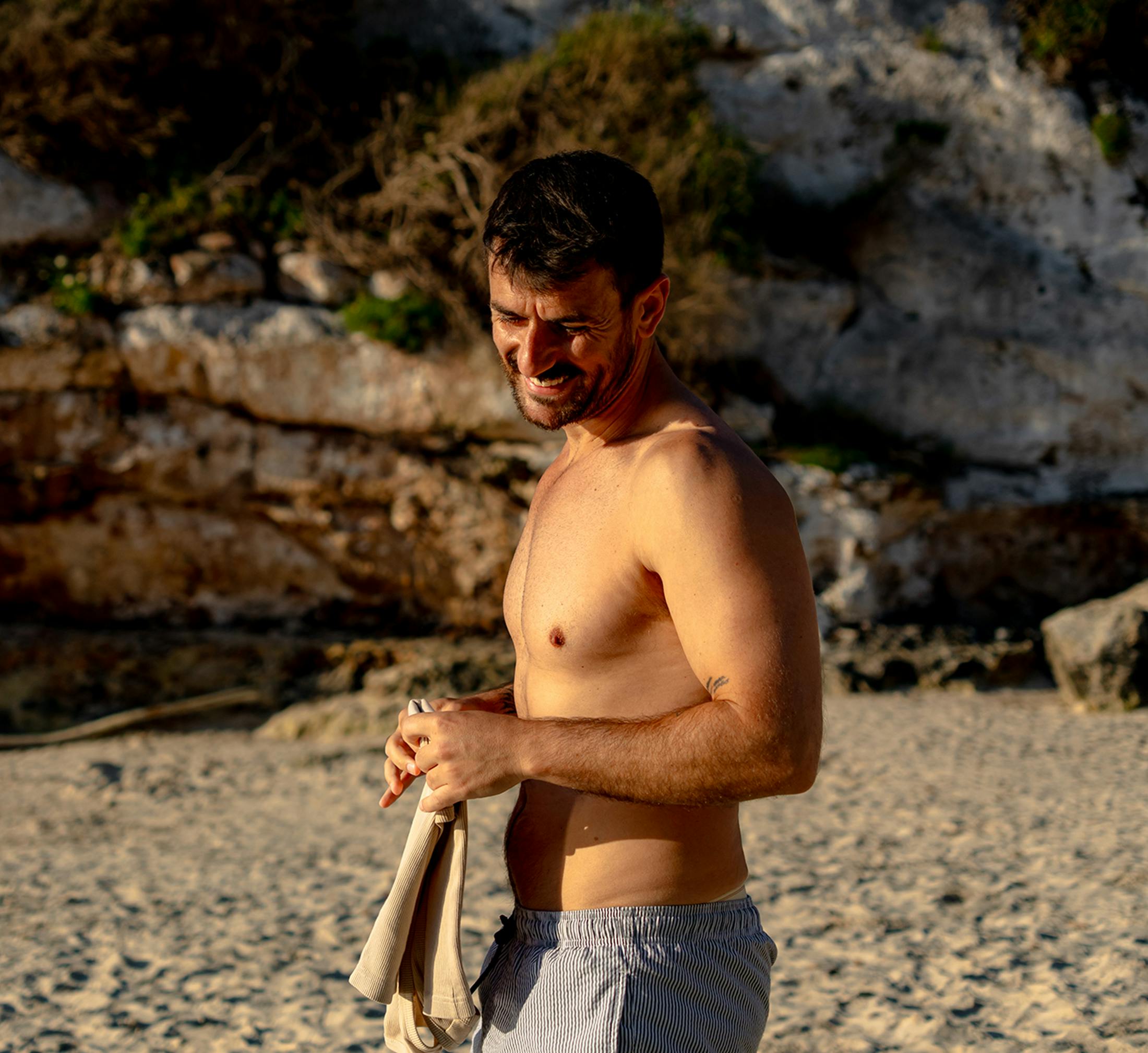 Man looking down and smiling