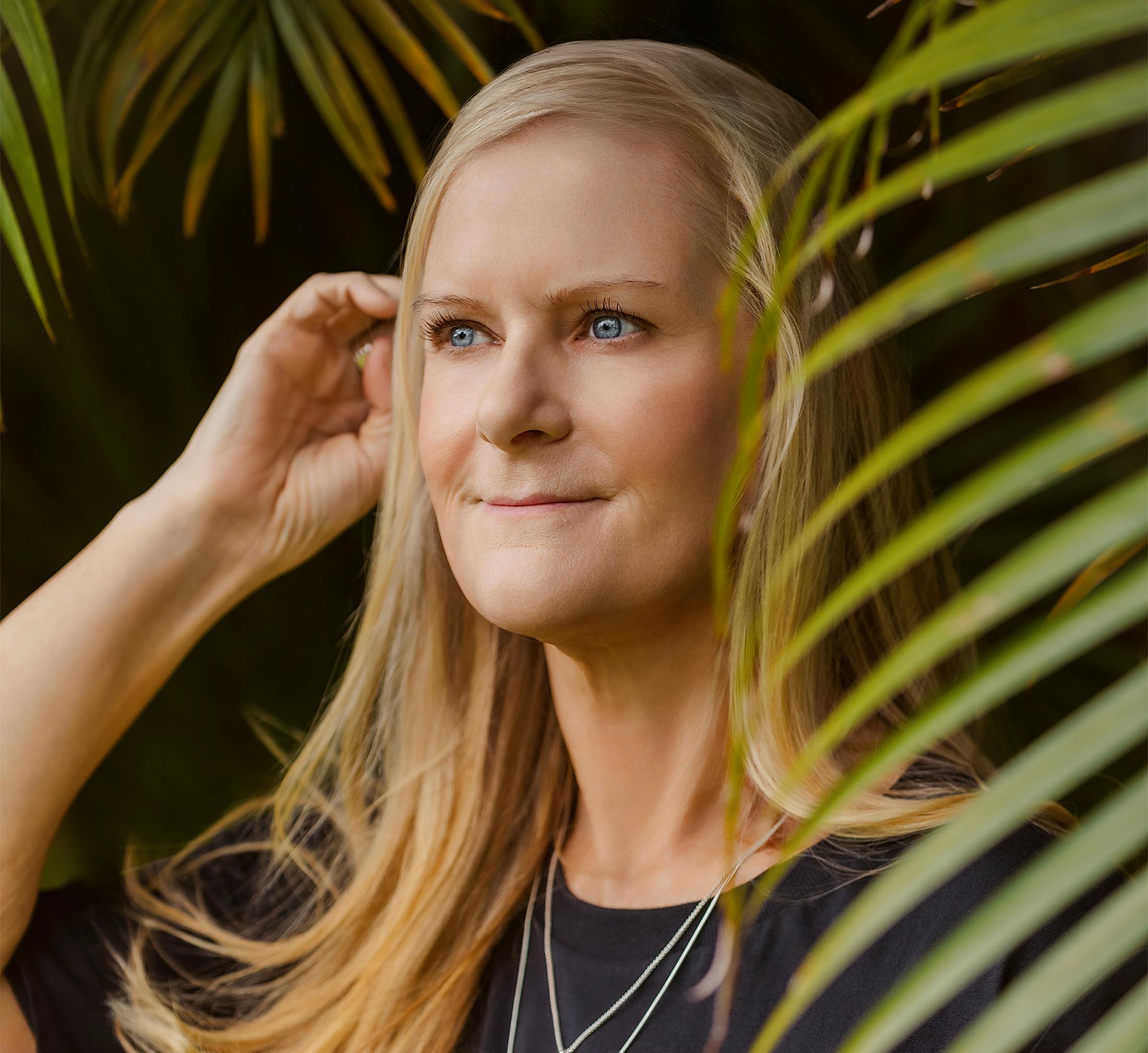 Woman posing with her hand in her hair