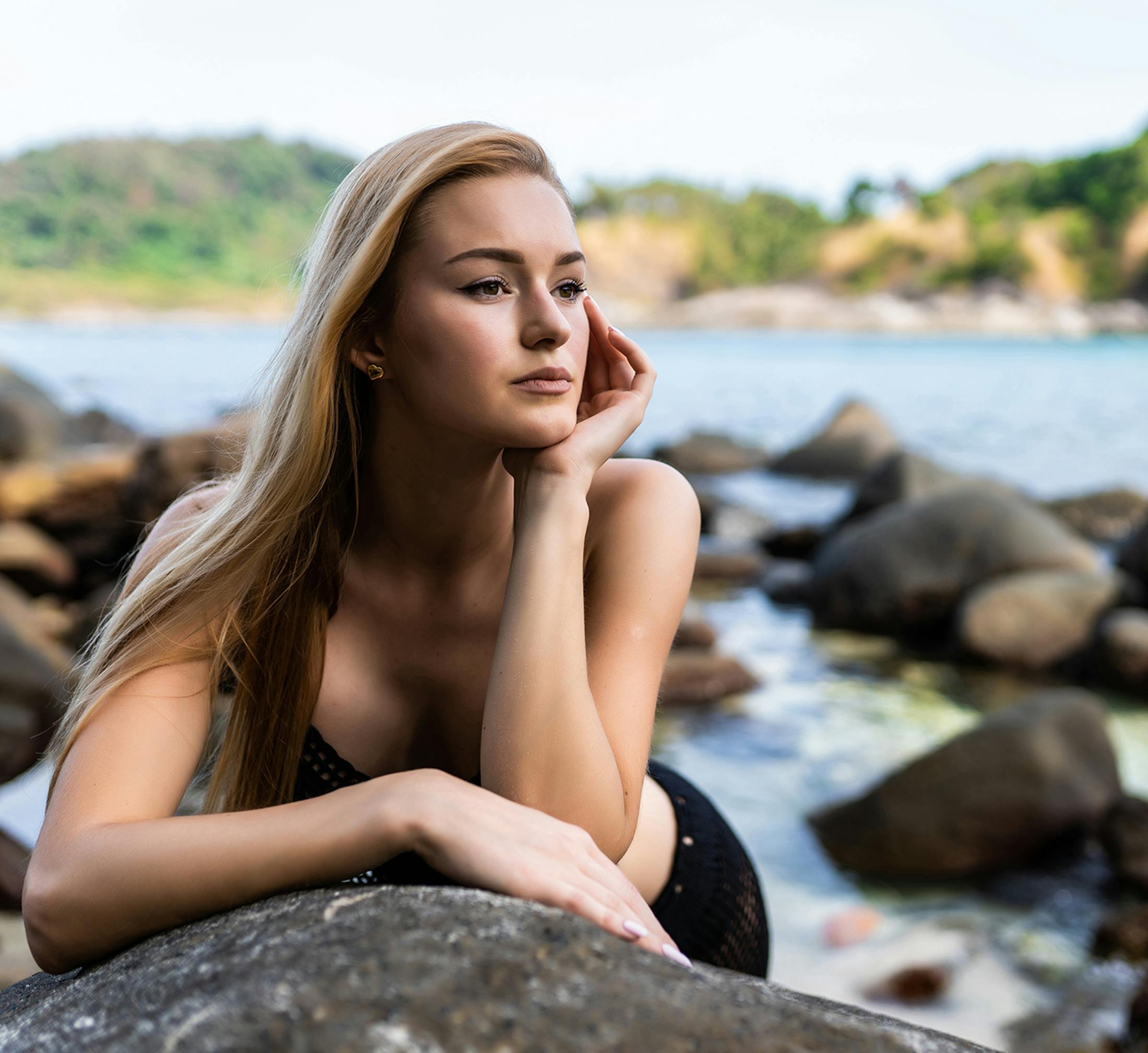Woman posing with her hand touching her face