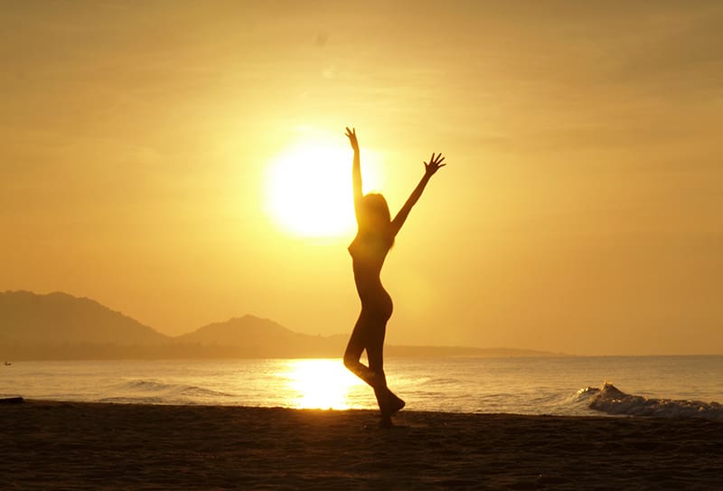 womans silhouette at sunset