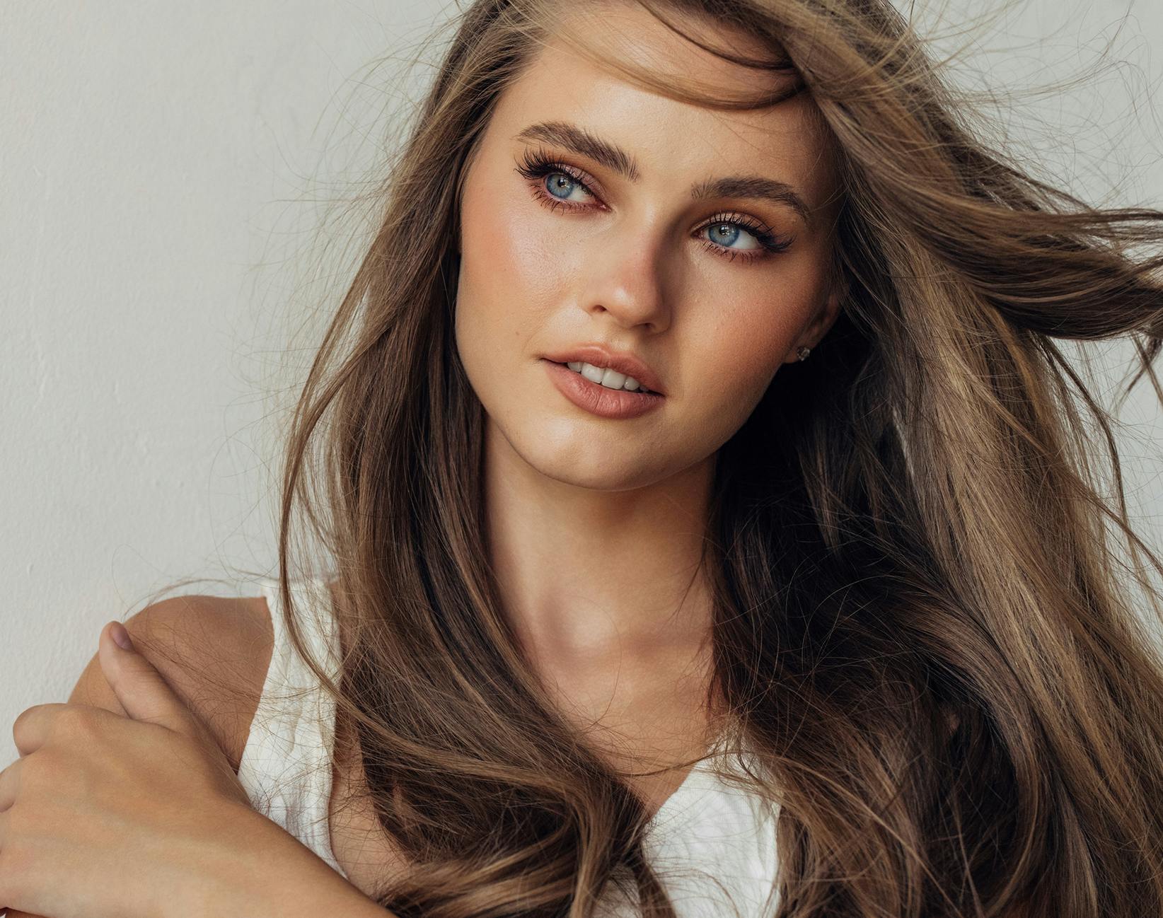 woman's hair being blown by wind