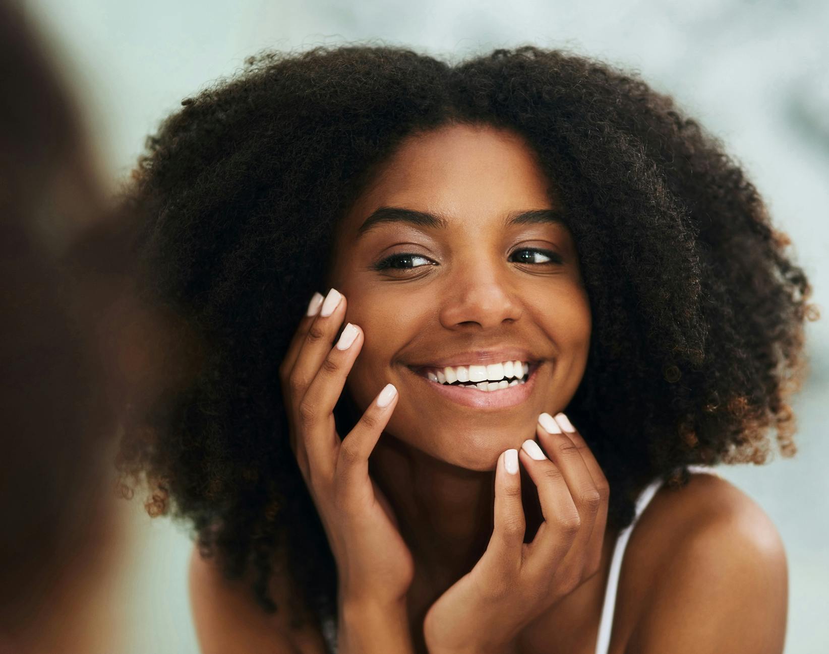 woman touching her face