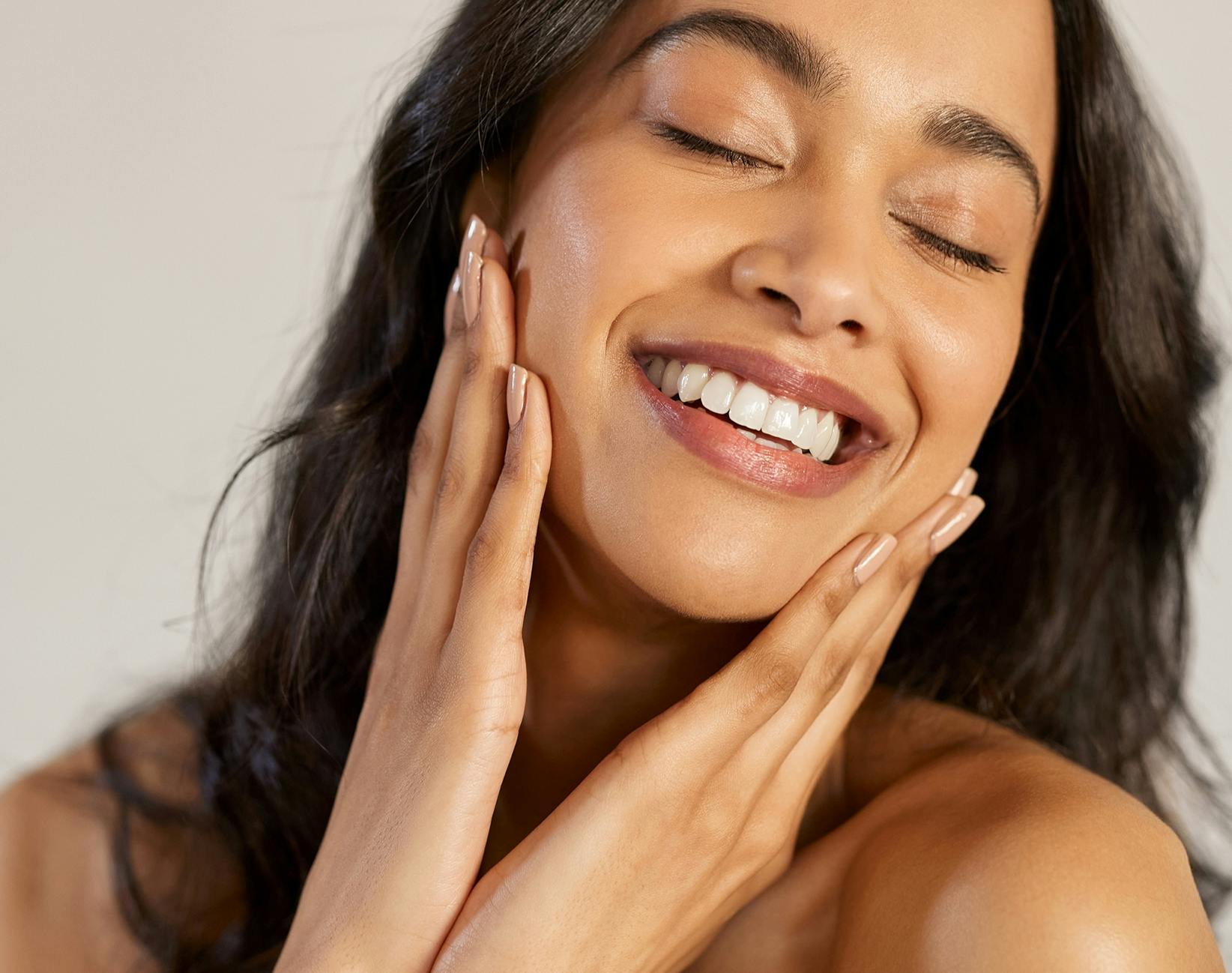 woman touching her face