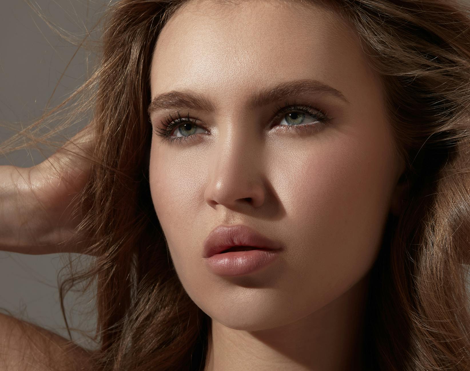 woman touching her hair