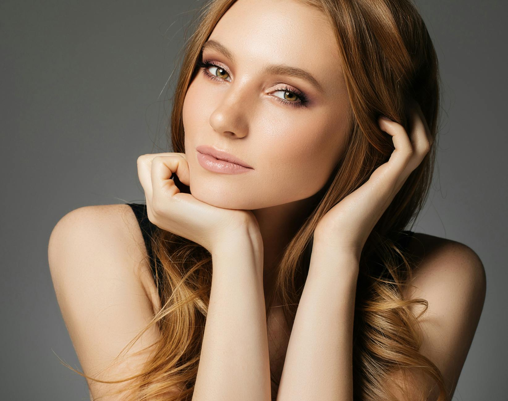 woman resting her head on her hand