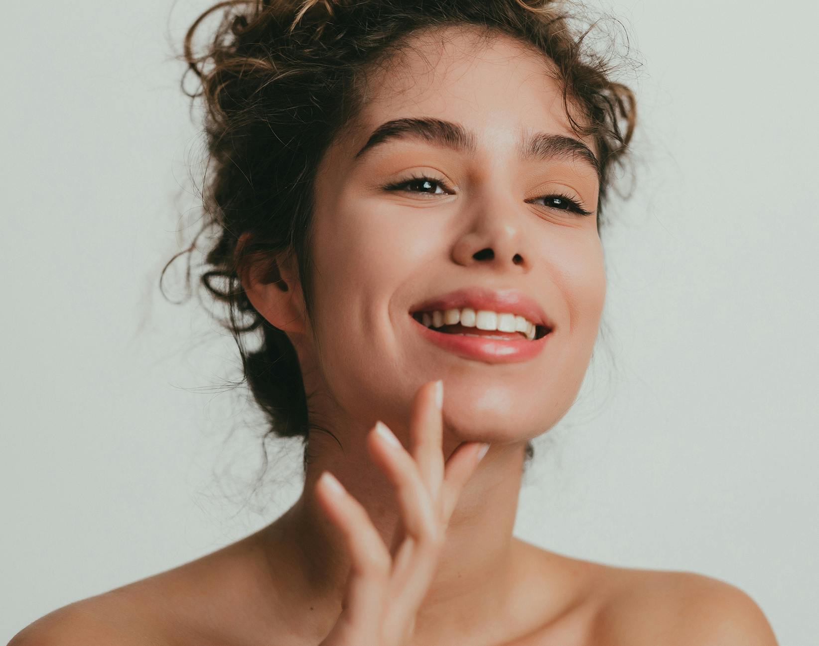 woman touching her chin