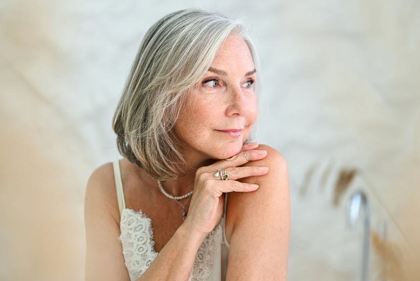 older woman looking over her shoulder
