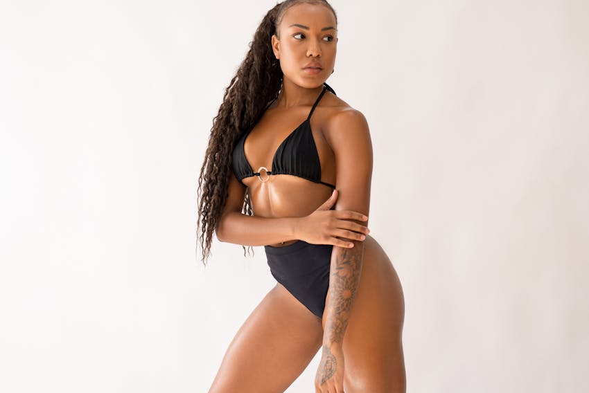 woman looking to the side holding arm