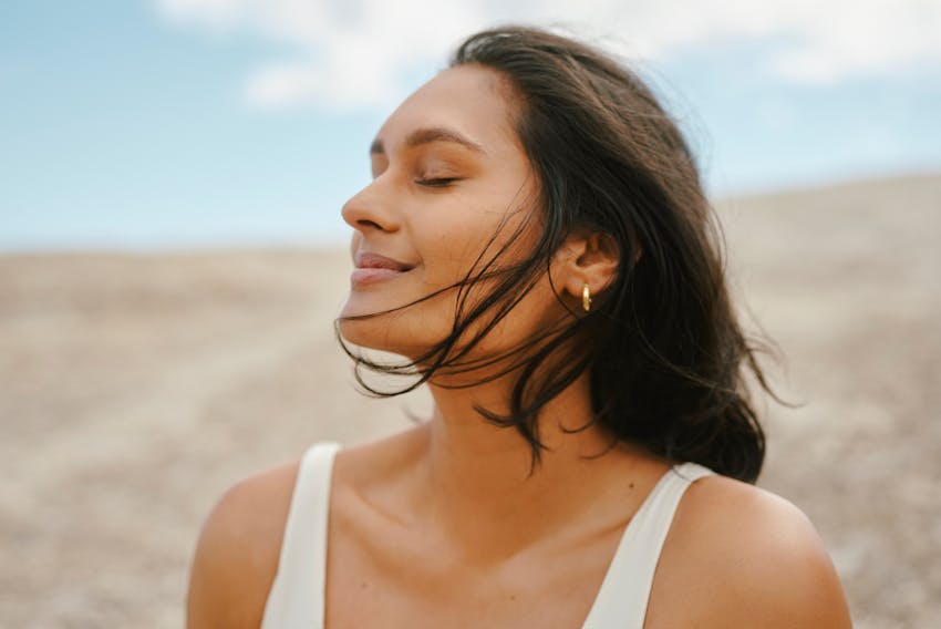 woman standing on a beach