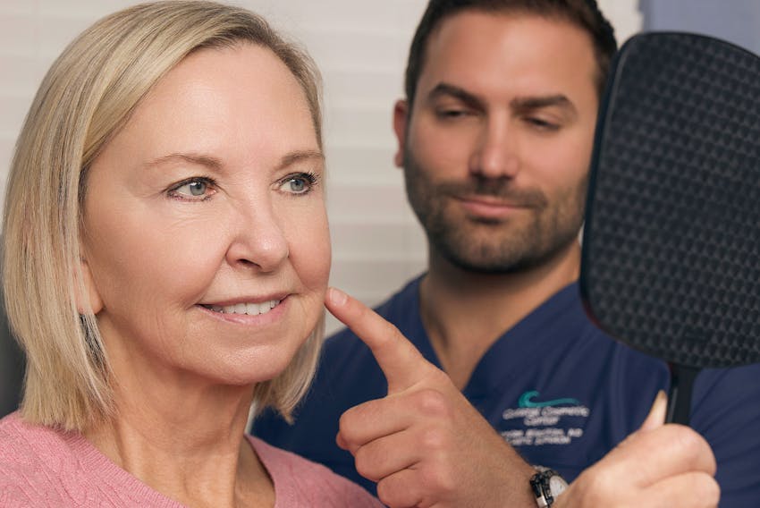 doctor pointing at a patient's face