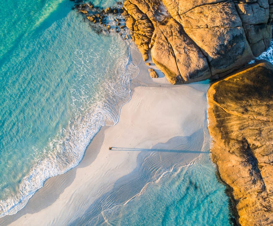 person walking on a beach