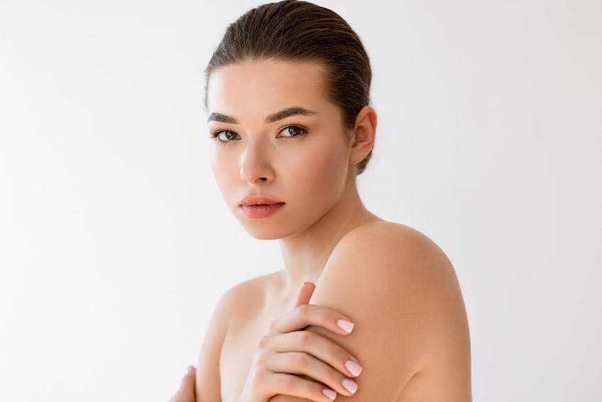 woman smiling over her shoulder