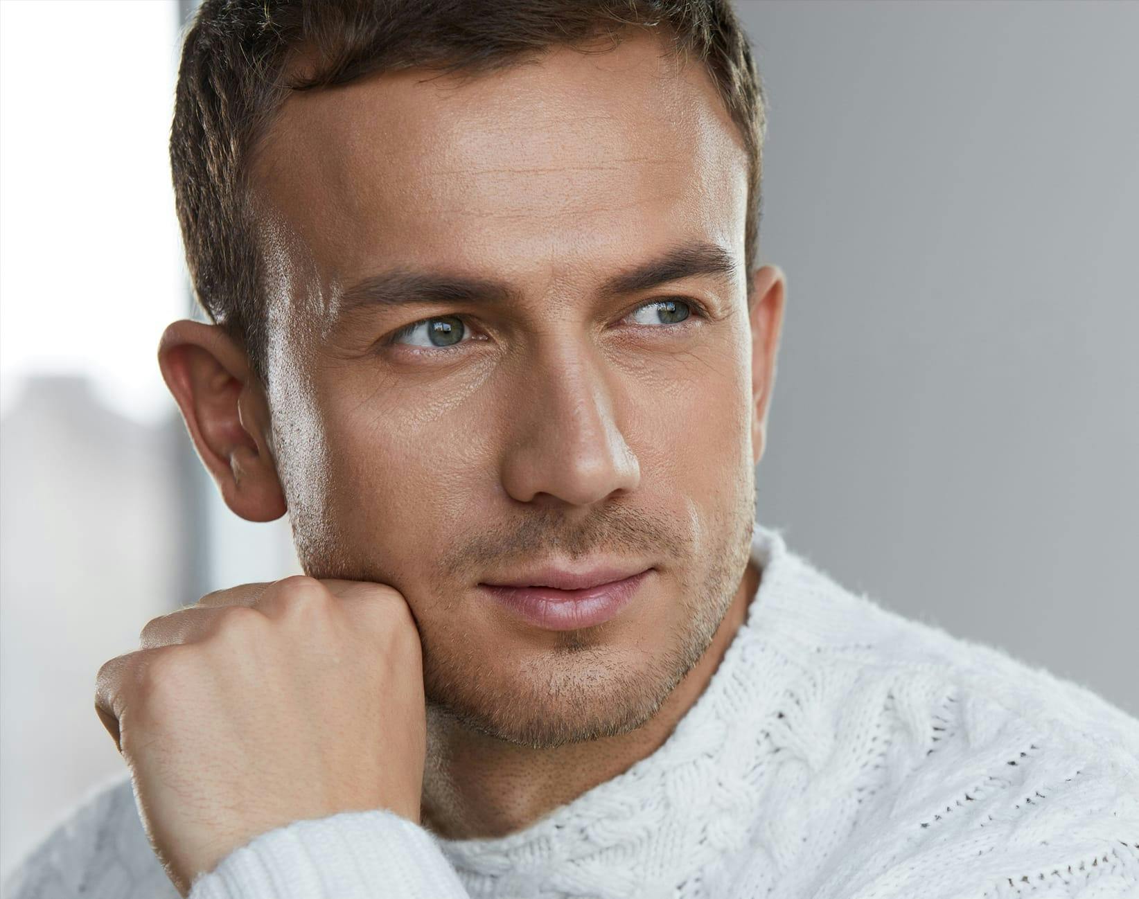 man in a white sweater