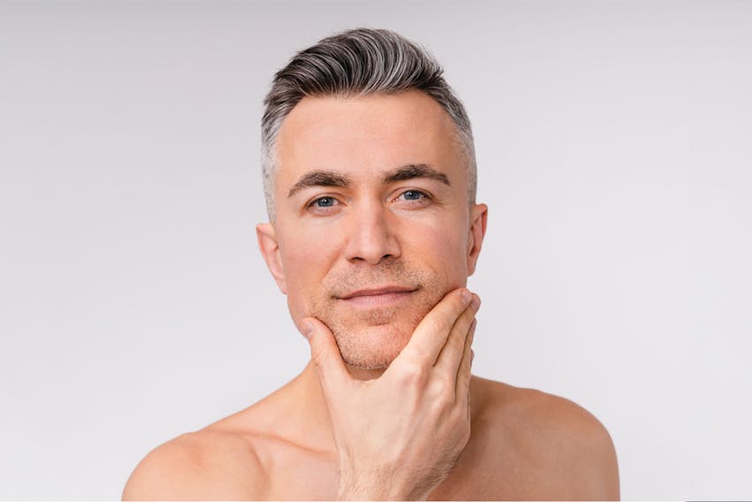 man touching his chin