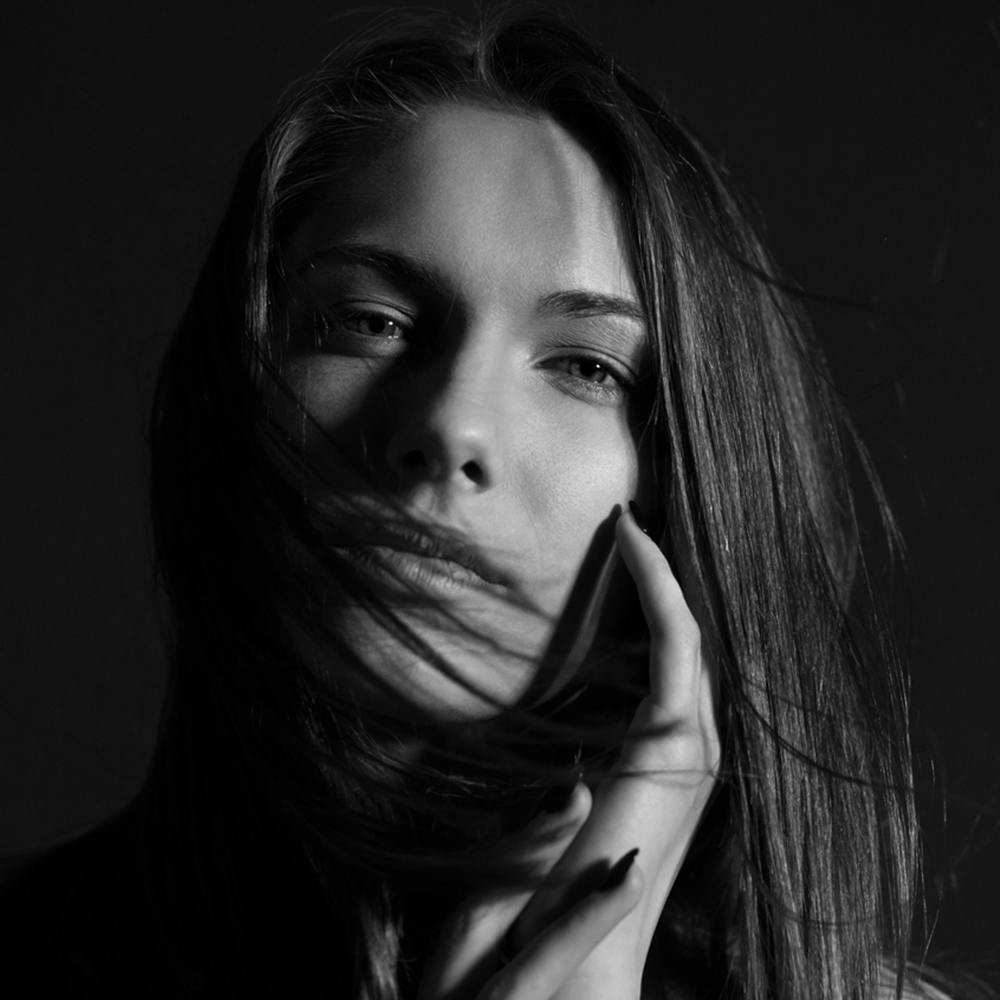 black and white image of a woman with long hair
