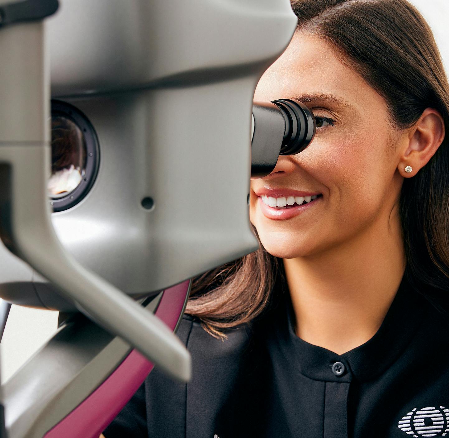 doctor checking a patient's eyes