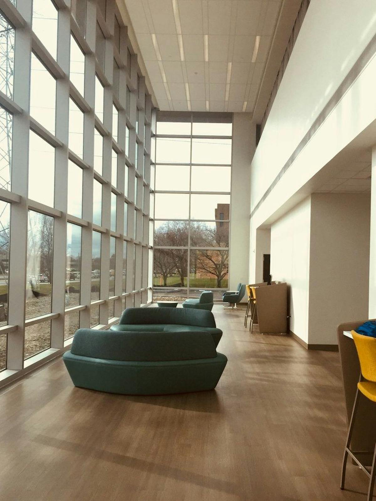 beautiful living room with a window wall