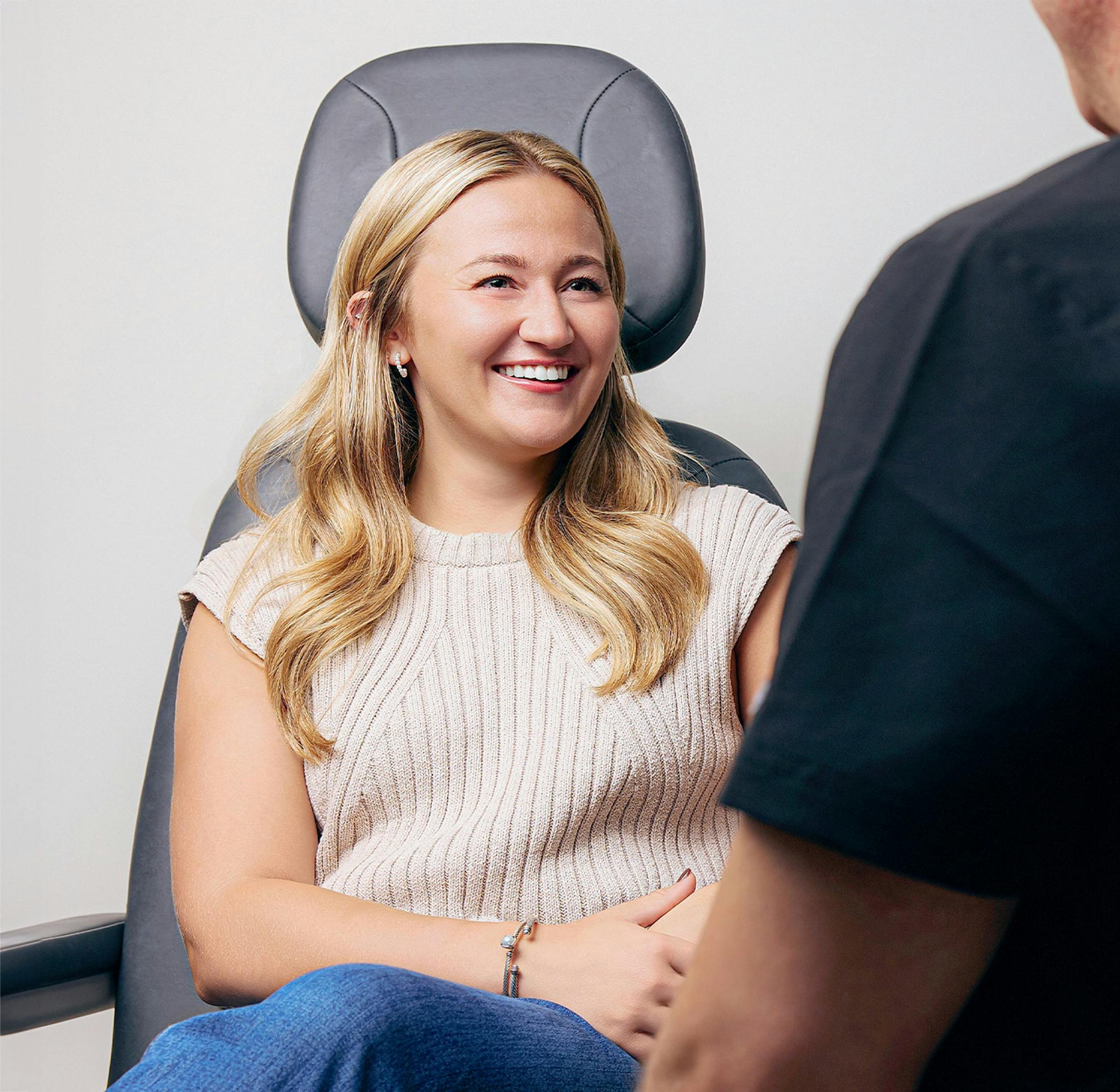 woman standing outside Eye Surgeons of Indiana