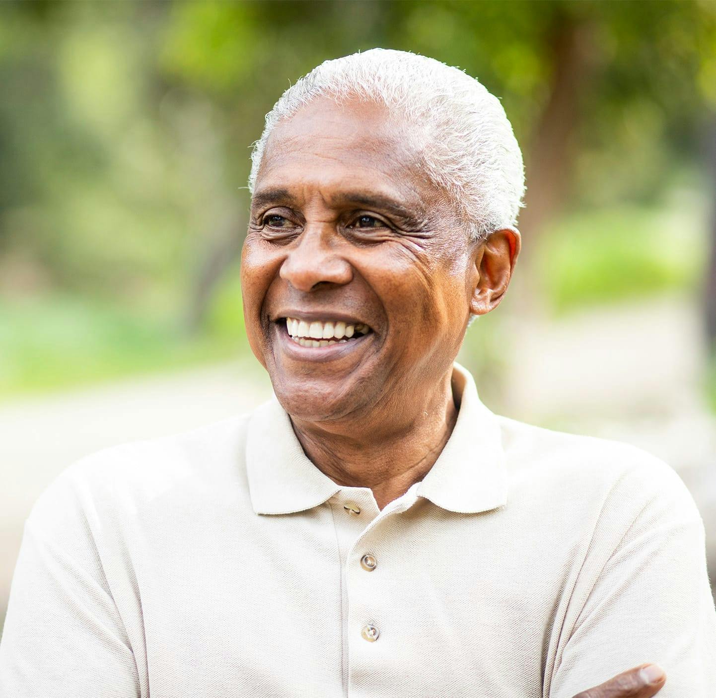 two women sitting on a couch smiling to each other