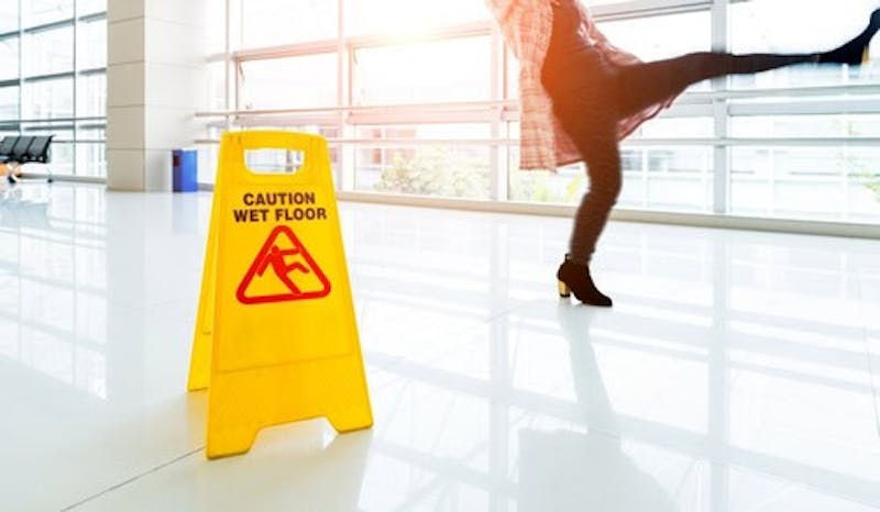 Woman slipping on a wet floor