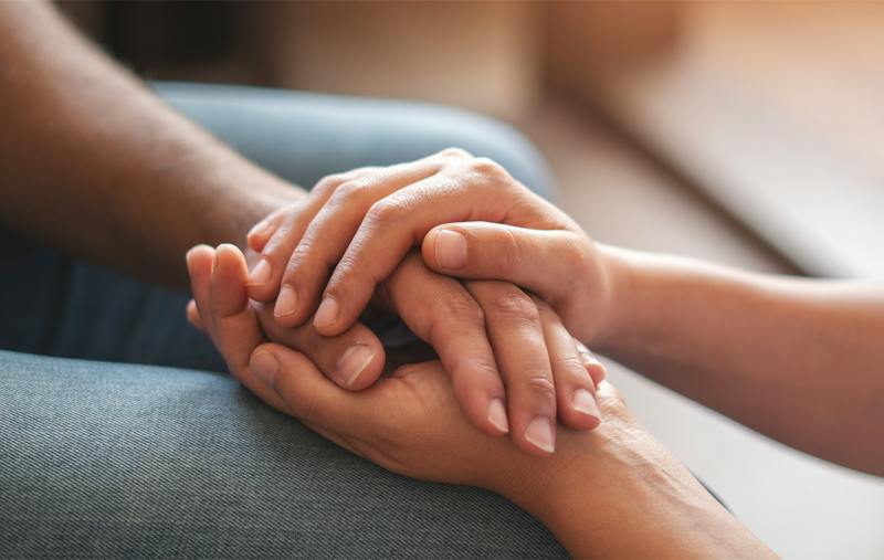 two people holding hands