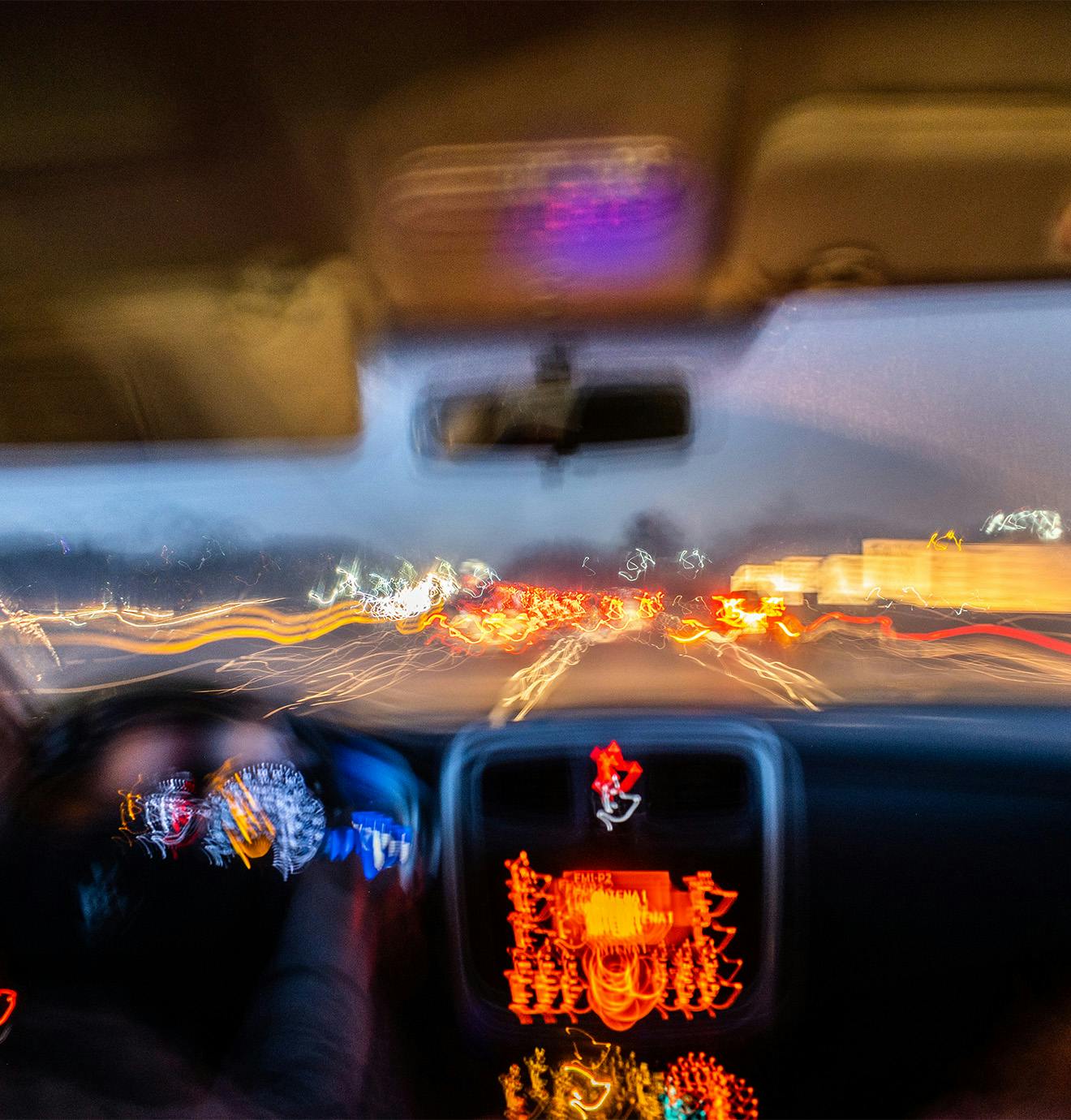 blurry photo of a car driving