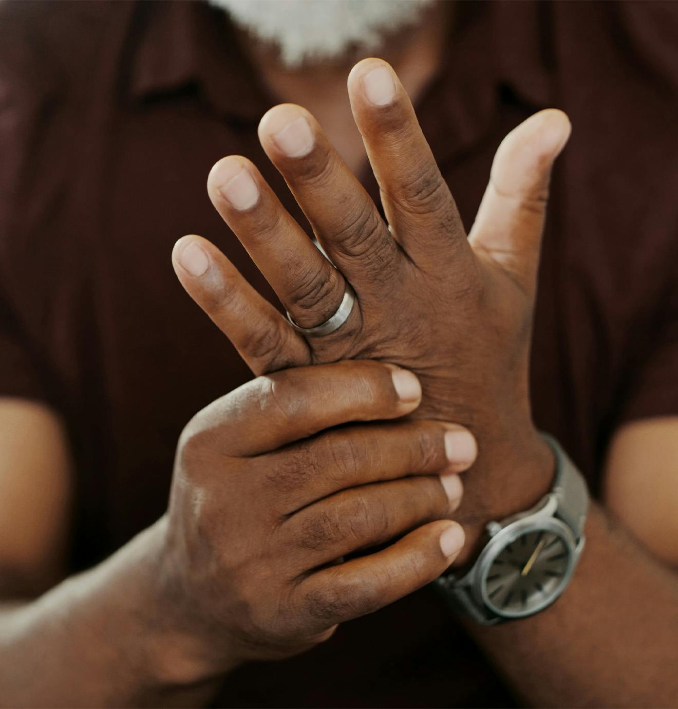 man holding his hand