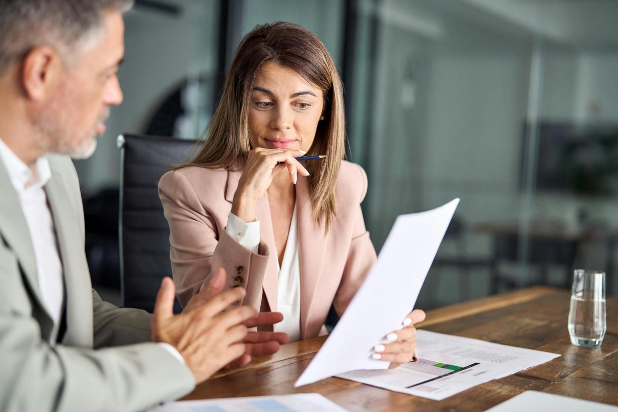 lawyer going over paperwork with a client