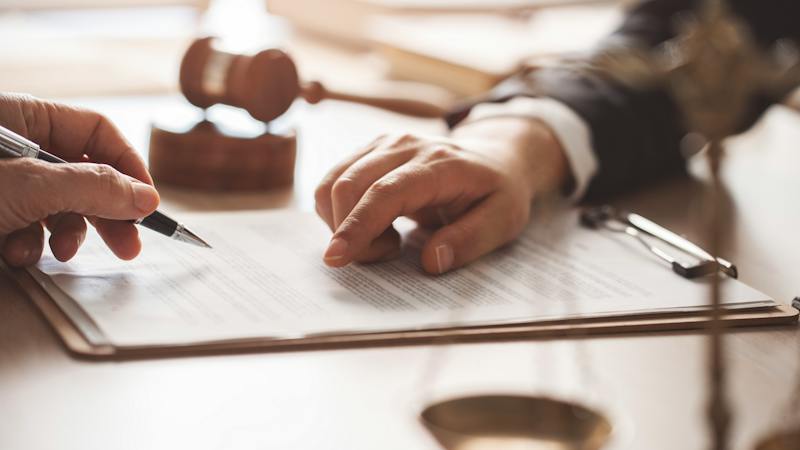lawyers going over paperwork