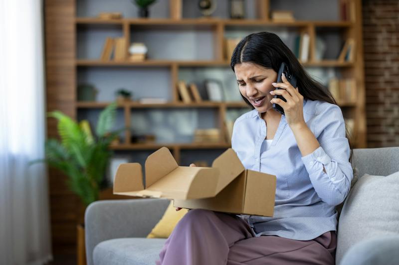 woman looking at an open box