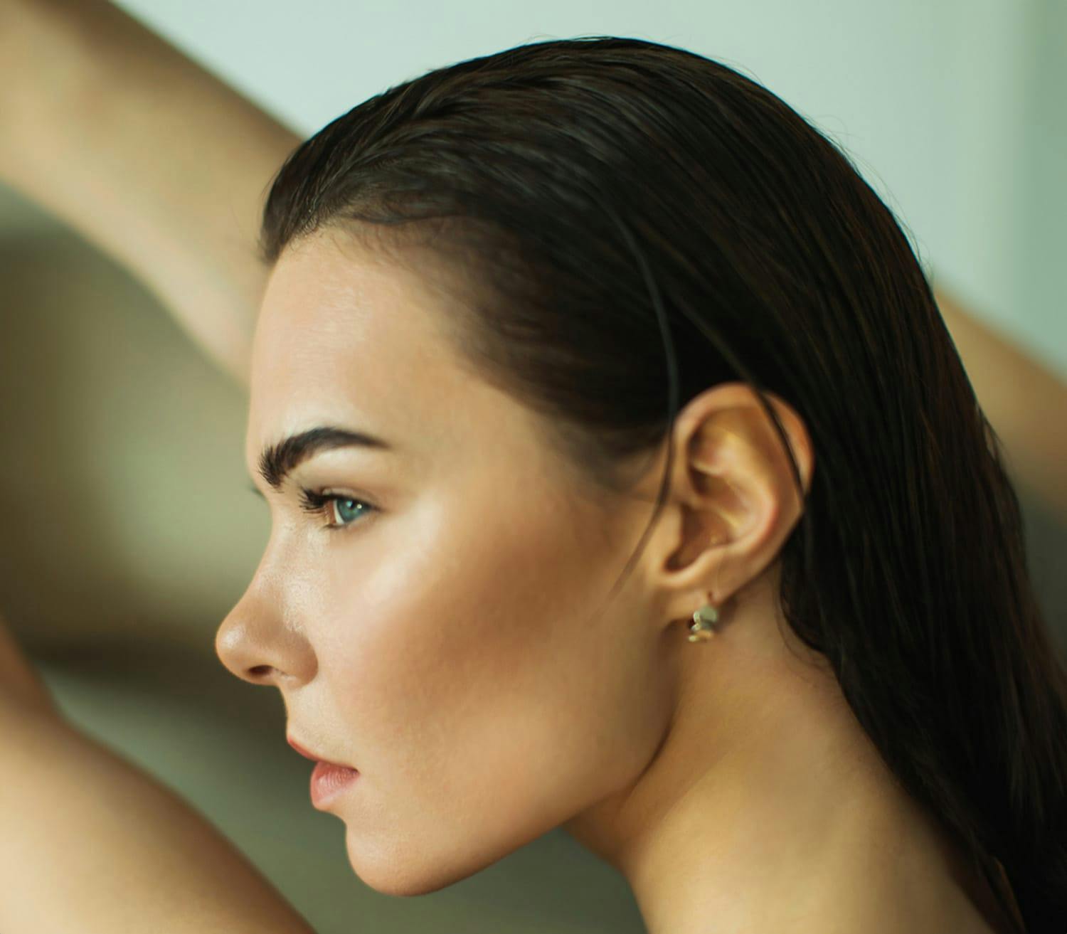 woman with slicked back black hair