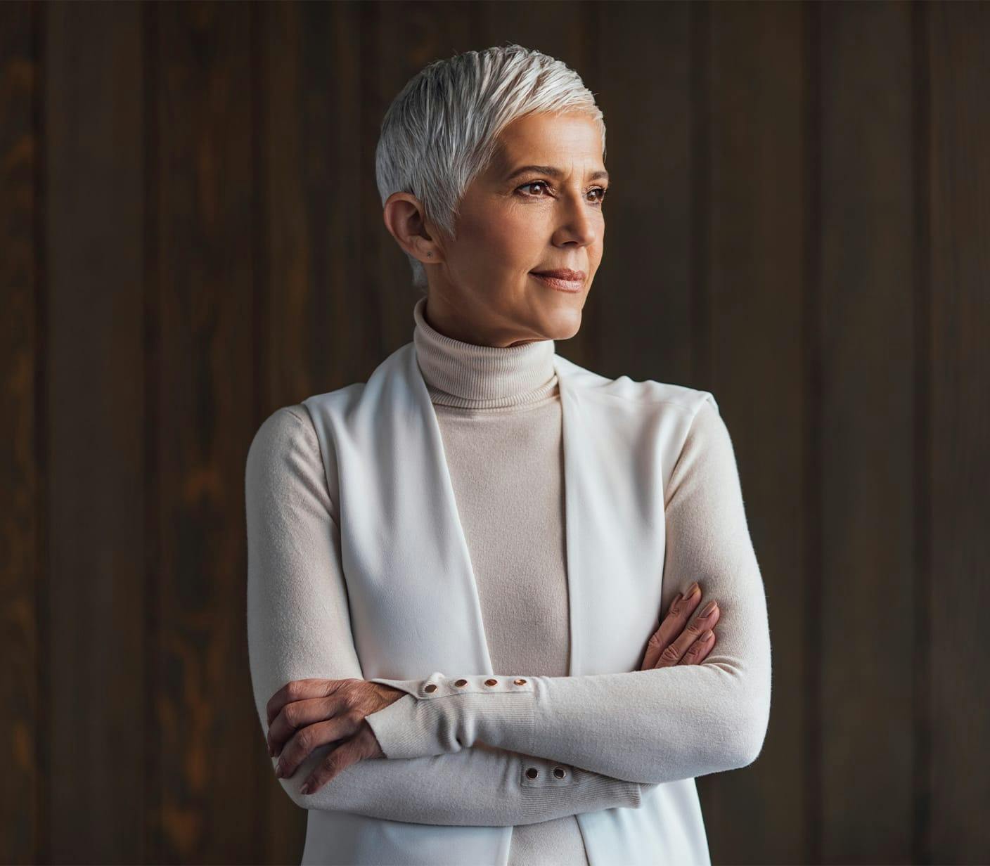 older woman with sweater looking away