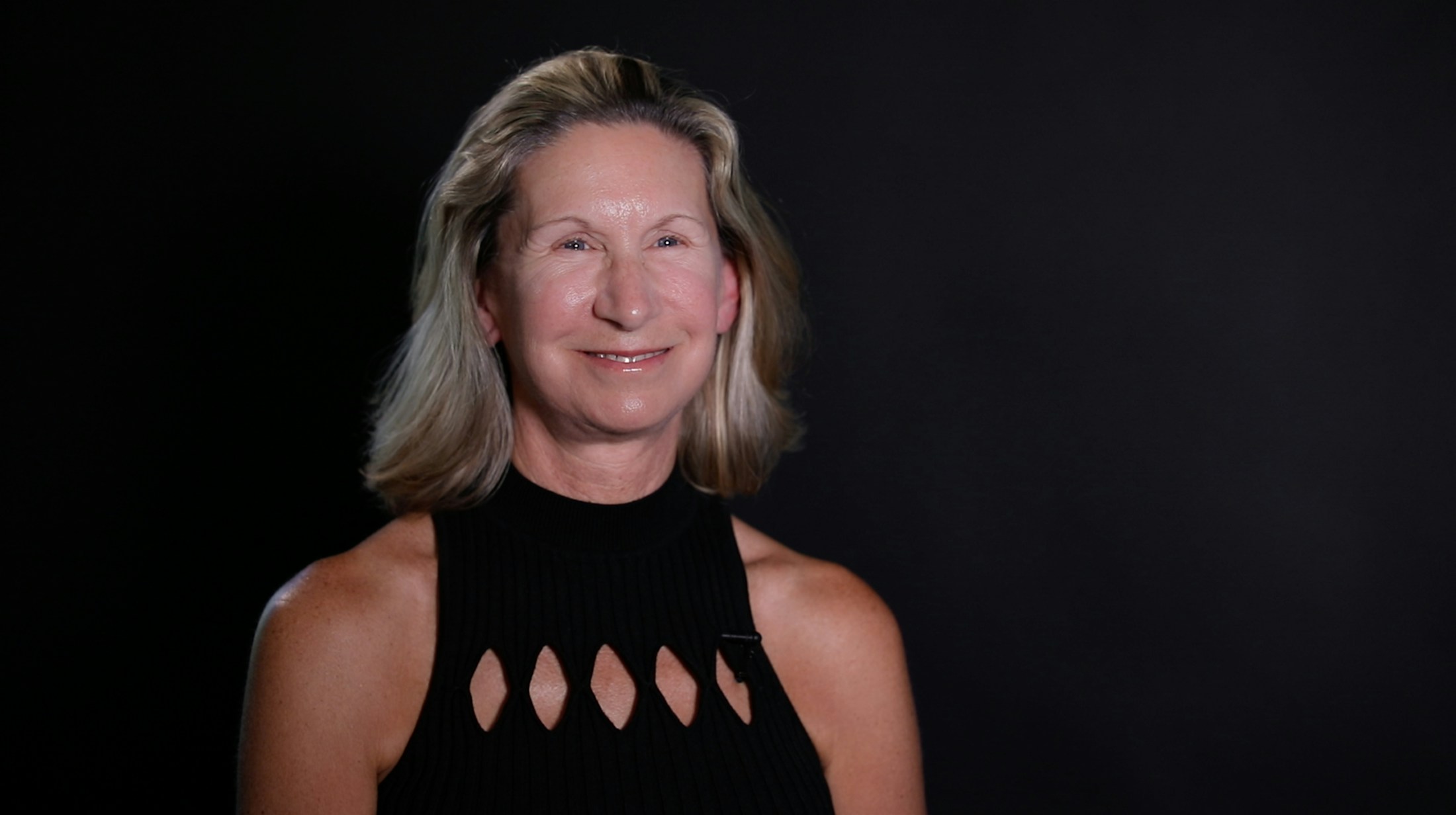 blonde woman smiling at camera