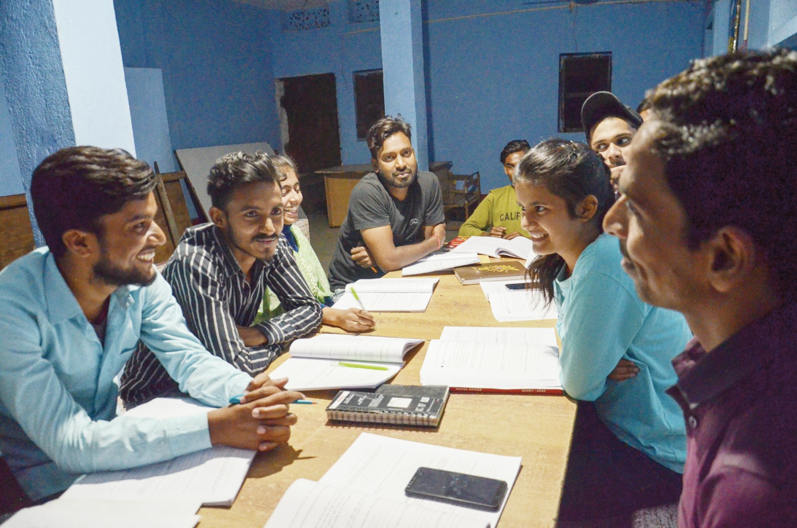 Youth studying in library, India
