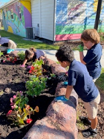 Children tending plants, United States