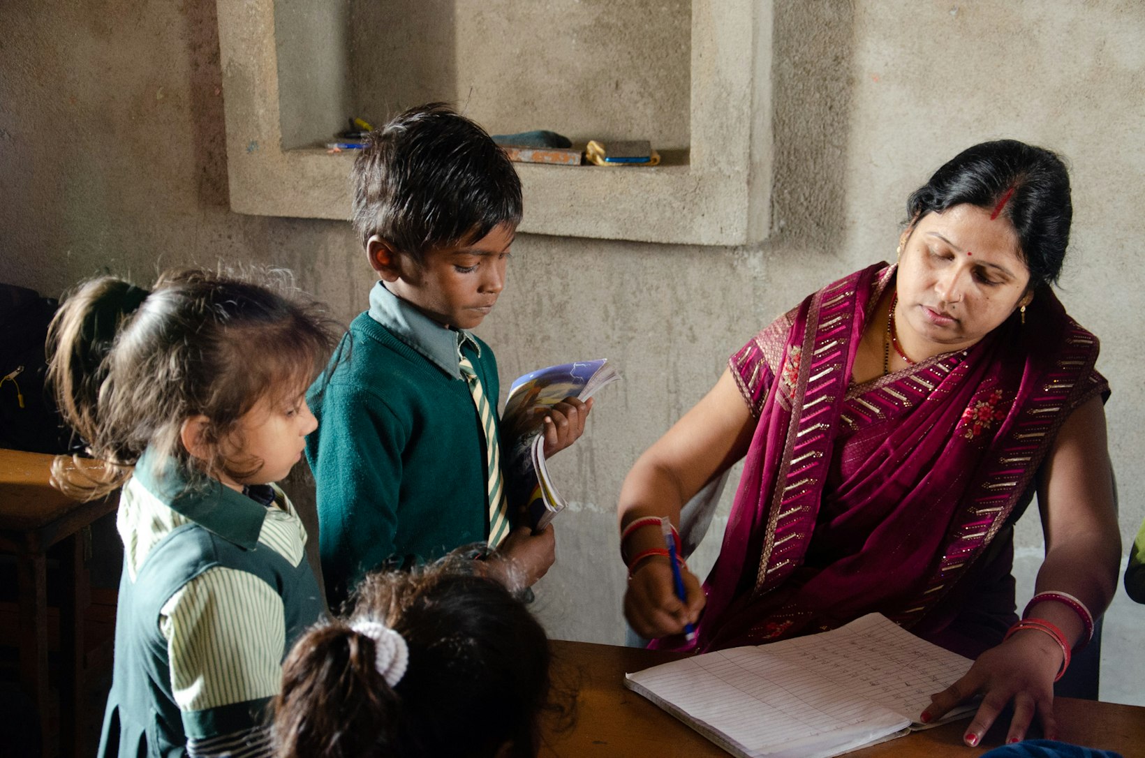 Teacher with students, India