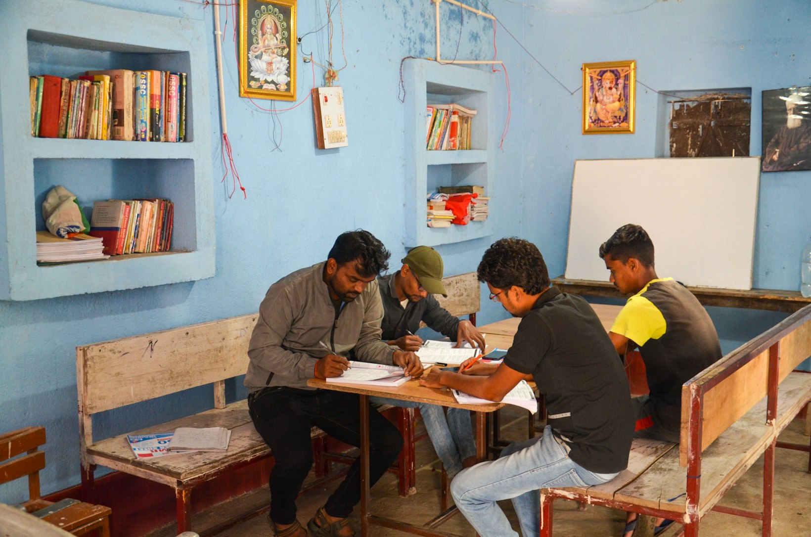 Group of youth studying in community library, India