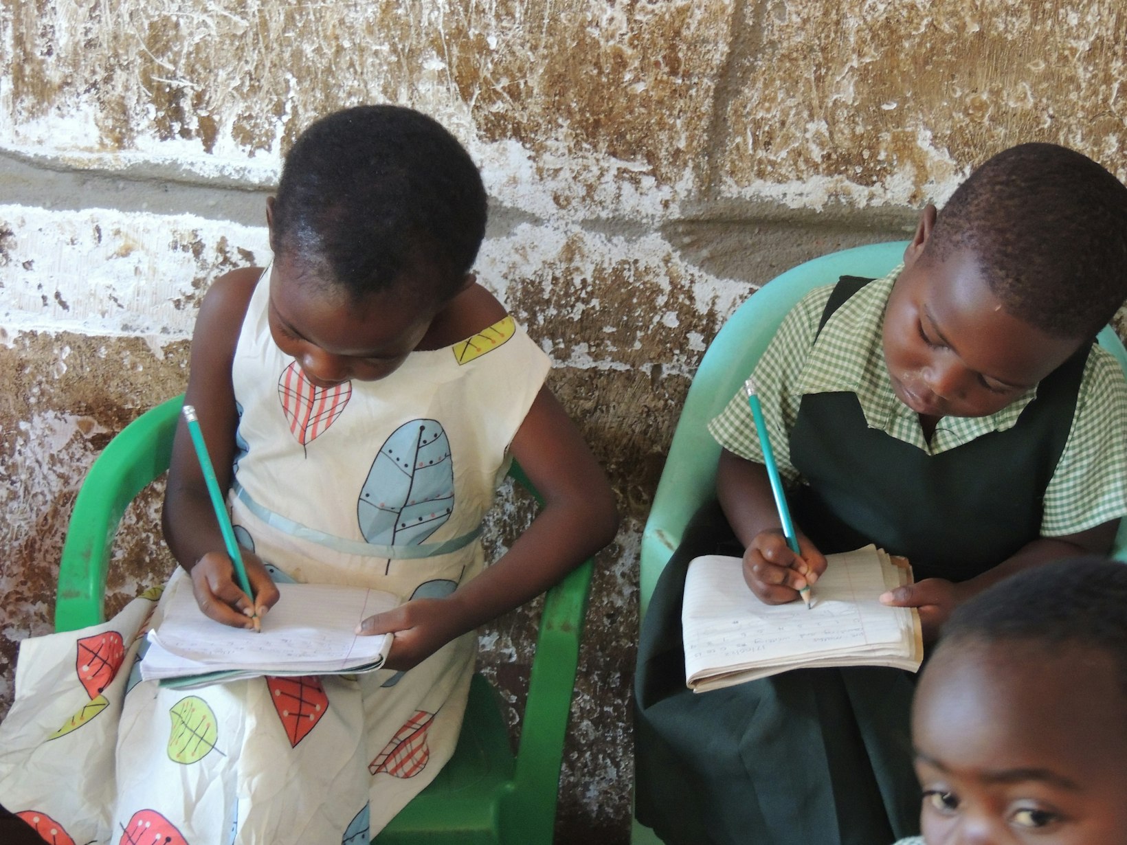 Children writing in class, Malawi