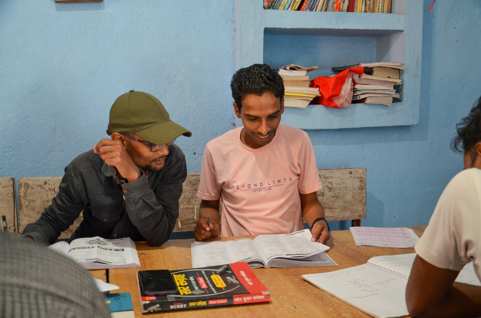 Youth studying in library, India