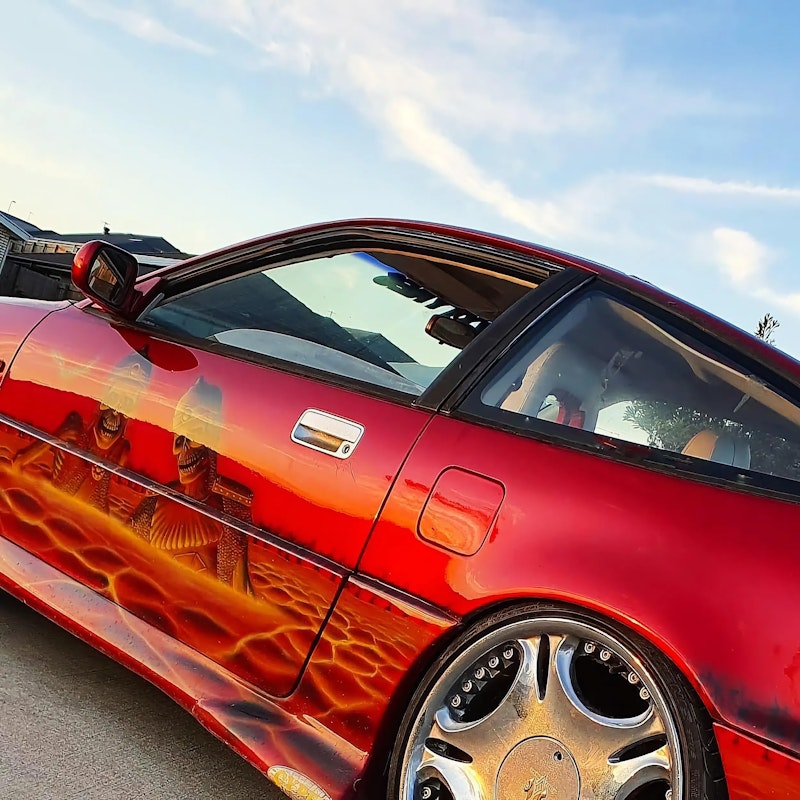 Red candy paint with skull mural airbrushing