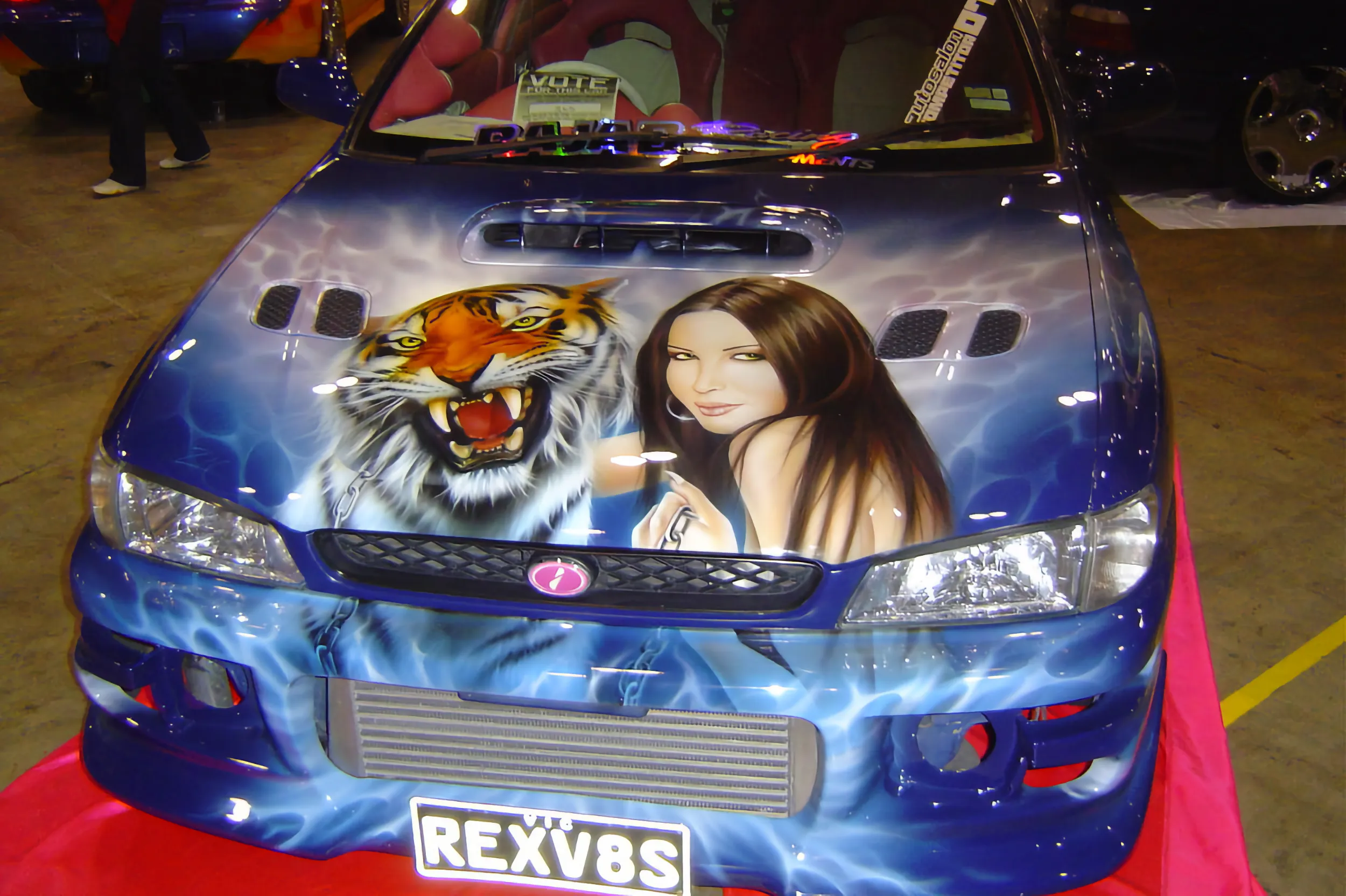WRX with airbrushed bonnet of woman and tiger.
